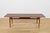 Coffee table made in Denmark in the 1960s. Table top with an interesting grain made of rosewood. The lower part of the...