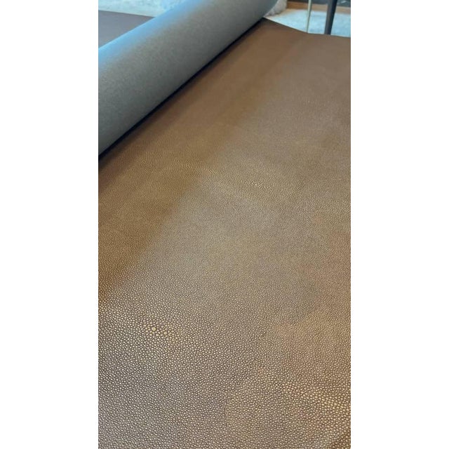 Taupe-copper colored luxury shagreen print vinyl fabric. Excellent quality upholstery fabric. 33 feet total, one...