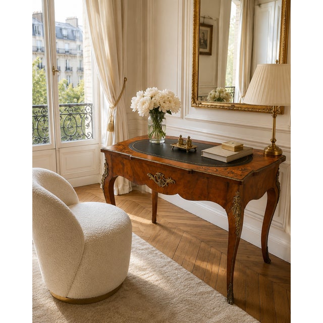 A beautiful antique French walnut freestanding writing desk of exceptional decorative quality. The shaped top is finely...
