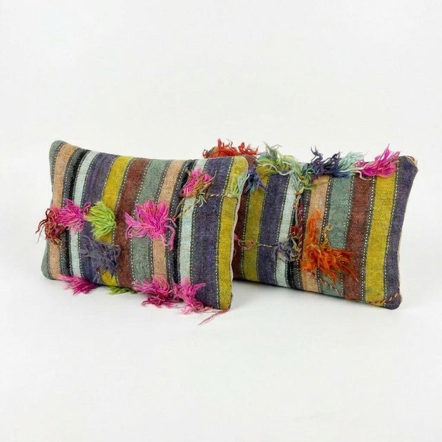 This beautiful 16'' x 24'' pillow cover set was made from authentic Turkish rug pieces. Bright colors of wool adorn the...