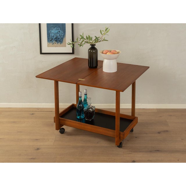A wonderful serving cart in the style of Grete Jalk from the 1960s. High-quality frame and removable tray made of solid...