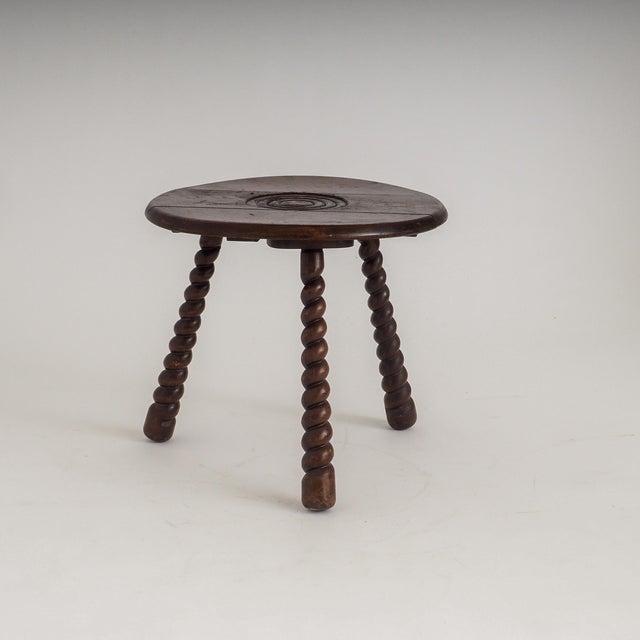 French wooden tripod side table with turned bobbin legs and concentric carved top attributed to Charles Dudouyt and...