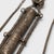 This curious chain of charms and tools is a traditional Chinese grooming kit, intricately worked of silver alloy with...
