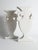 A striking pair of Postmodern flattened ceramic urn vases from the 1980s, finished in a clean, glossy milk-white glaze....