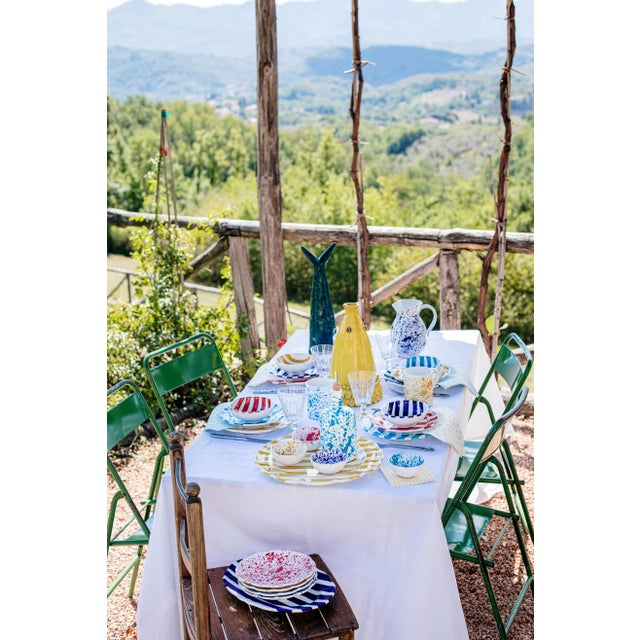 The Amalfitana Cobalt Stripe Mug pays homage to the Amalfi Coast's fresh seaside style, and its bold hues and crisp design...