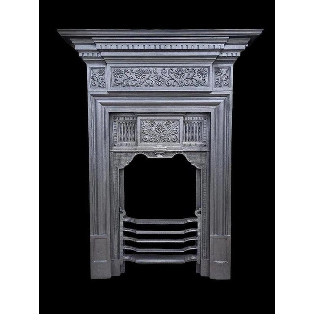 A handsome Edwardian cast iron combination fireplace by Coalbrookdale, one of Britain's most celebrated historic iron...