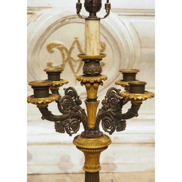 Dating to the early 19th century (circa 1830s), this pair of period Charles X lamps would make fantastic light sources for...