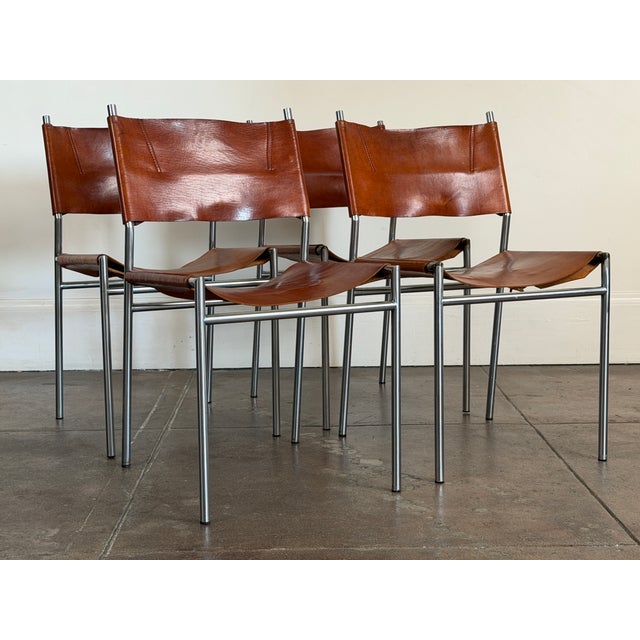 Elegant set of four dining chairs designed by Martin Visser for Spectrum featuring beautifully patinated leather...