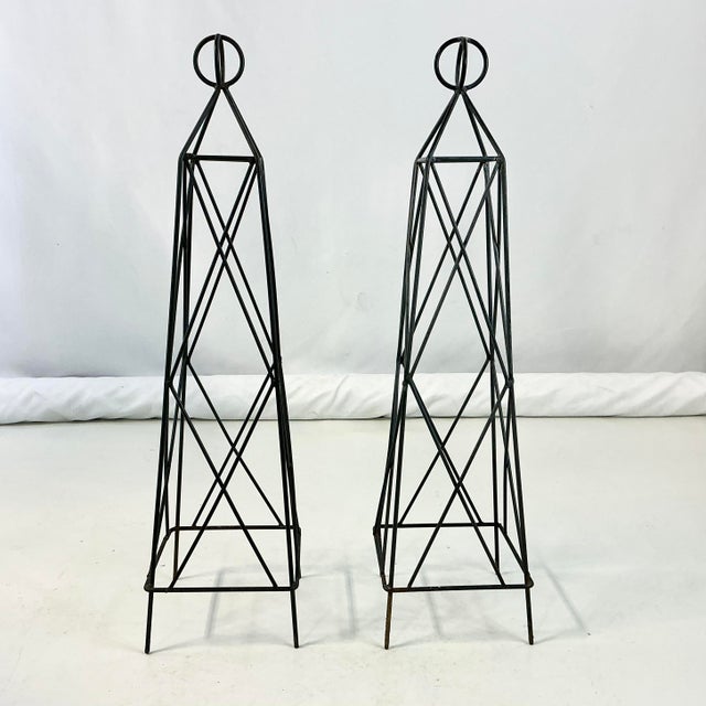 These are a pair of French Garden Topiary Trellis Frames. They stand 27" after you push the four leg spikes in the ground....