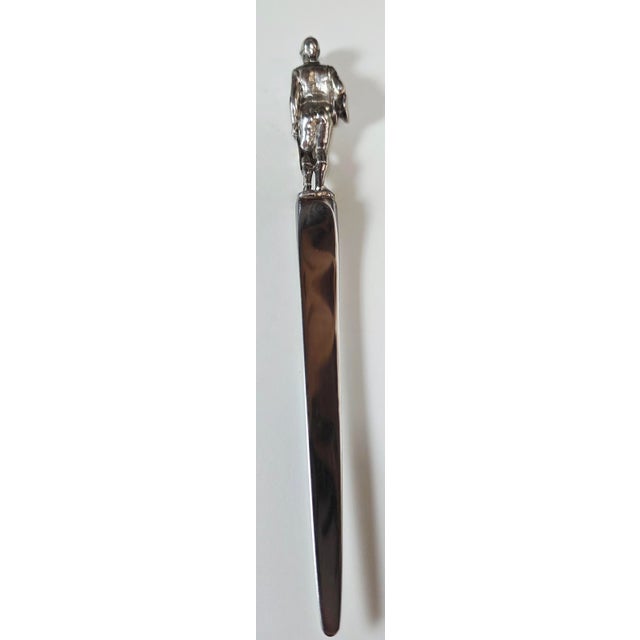 This item is a highly collectible vintage Tiffany & Co. letter opener. It features a finely detailed sterling silver...