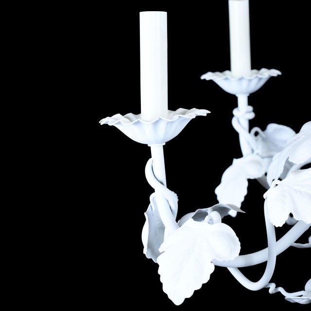 A vintage ornamental chandelier in white, sized for an entry, breakfast room or bath where a little theatre is welcome....