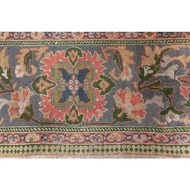 A late 19th century Persian Sultanabad antique carpet, the ivory field with an angular leaf, flowering vine, and geometric...