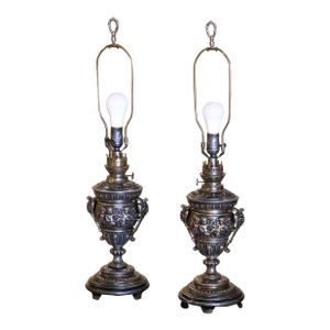 Pair of 19th Century French Polished Repousse Urn-Shaped Table Oil Lamps