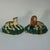 Pair of Staffordshire Pottery porcellaneous figures which feature a lion and a lioness with her cub, recumbent on a shaped...