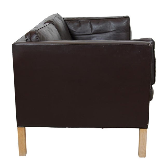 Børge Mogensen 2. seater sofa model 2442, upholstered in dark brown leather. The sofa is from the 70's and appears with a...