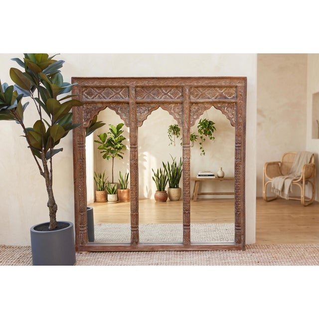 This Lotus Arched mirror is a breathtaking architectural anchor that captures the rhythmic elegance of traditional palace...