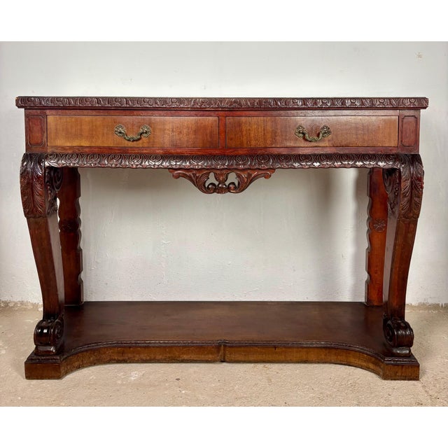 This elegant Spanish console table of wood showcases the rich character of traditional Spanish craftsmanship. Featuring...