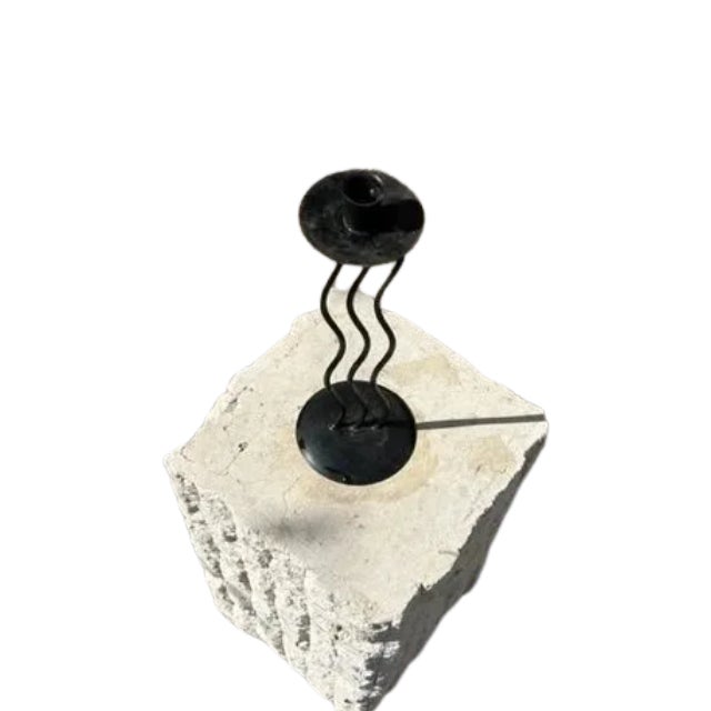 Throwback to the 90s with the squiggly style metal candlestick. Great way to add some light and fun to your space.