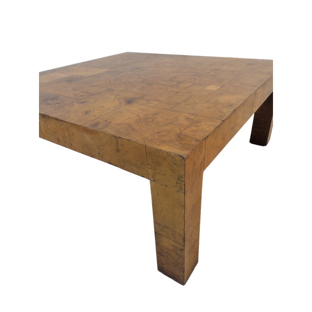 This coffee table is made out of burl walnut wood squares. Attributed to the style of Paul Evans based on design and...