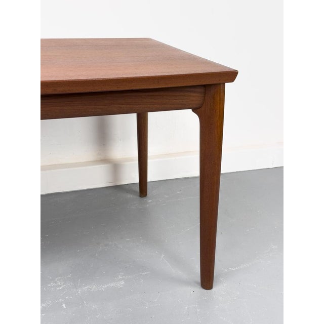 Rare, organically shaped teak dining table by Glostrup of Denmark with a boat-shaped main tabletop and two extensions that...