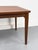 Rare, organically shaped teak dining table by Glostrup of Denmark with a boat-shaped main tabletop and two extensions that...