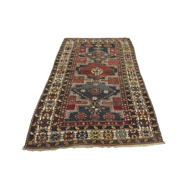 Antique decorative handknotted wool Caucasian rug.Approximately 85-95 years old. In good condition.