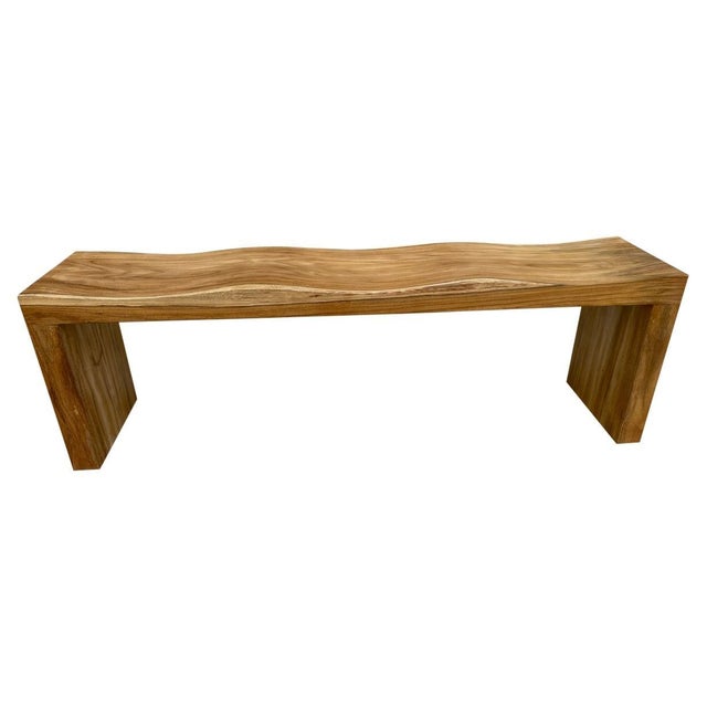 The teak wood wave bench represents a sleek, modern aesthetic, designed to provide comfort and durability. A solid single...