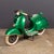 A vintage 20th century child-sized piaggio vespa pk50 from an italian fairground ride, finished in classic green. This...