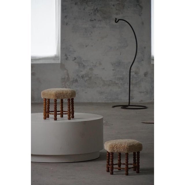 This elegant pair of stools is a refined example of Danish Modern design, crafted by a skilled Danish cabinetmaker in the...