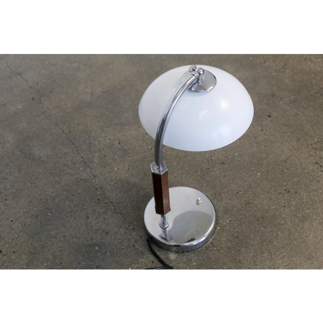 - A very decorative table lamp from the Art Nouveau period - Metal bracket with wooden surround - Beautiful glass shade...