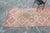 A lovely hand-knotted runner with a diamond medallion design taking center stage. Featuring colors such as dark grapefruit...