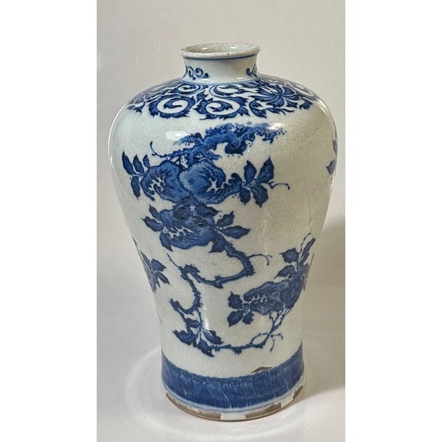 A striking example of Japanese ceramic artistry, this Satsuma-style vase features a traditional scene of the Immortals...