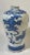 A striking example of Japanese ceramic artistry, this Satsuma-style vase features a traditional scene of the Immortals...