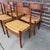 Offered is a set of six Hans J. Wegner CH-40 dining chairs, crafted in solid teak with woven cane seats. Designed with...