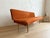A beautifully designed Mid-Century sofa by Miroslav Navrátil, featuring elegant wooden legs, clean sculptural lines, and...