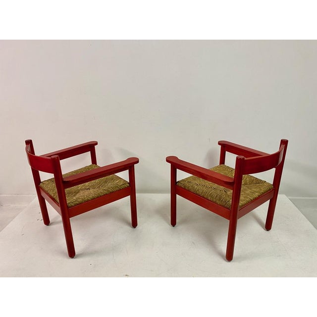 Pair of armchairs Red beech frame Rush seats Similar in style to designs by Vico Magistretti Seat height 40cm Italy 1960s
