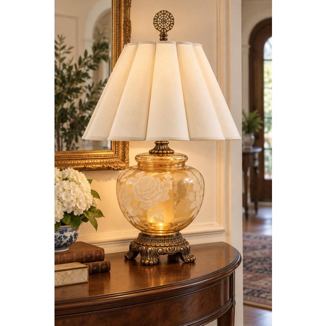 A dramatic vintage statement lamp combining luminous amber glass, romantic floral ornament and richly detailed Venetian-...
