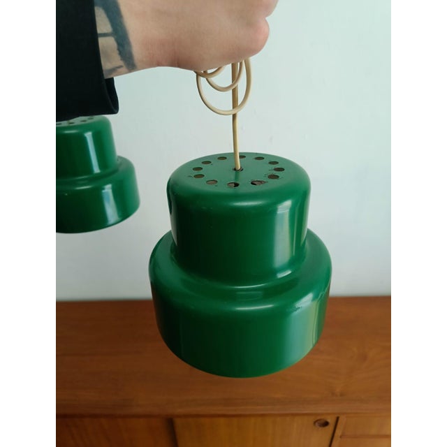 A pair of vintage Bumling pendant lamps by Anders Pehrson for Atelié Lyktan, from the 1960s. Bright red lacquered metal,...