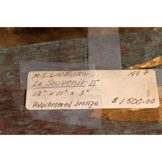 An intriguing polychromed bronze hanging wall sculpture titled “Le Souvenir II” by M.S. Linburg. Signed in the metal on...