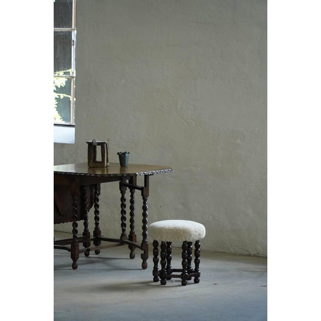 This elegant stool is a refined example of Danish Modern design, crafted by a skilled Danish cabinetmaker in the 1950s....