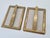 An elegant pair of brass picture frames with a simple, geometric design and a distinctive oval opening for a photograph....