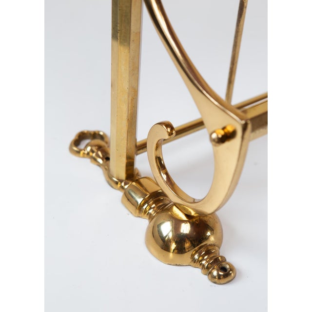 It is a solid, heavy brass coat rack.