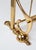 It is a solid, heavy brass coat rack.