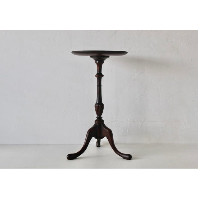Vintage mahogany wine table featuring a traditional turned pedestal and tripod base. A well-made vintage wine, tea, or...
