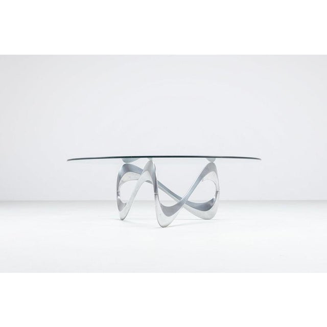 A striking and highly sculptural model “snake” coffee table designed by knut hesterberg for ronald schmitt, germany 1965....