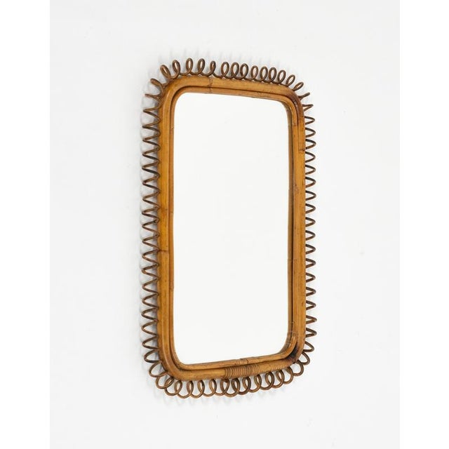 Midcentury beautiful rectangular wall mirror in bamboo, rattan and wicker in the style of Italian design Franco Albini....