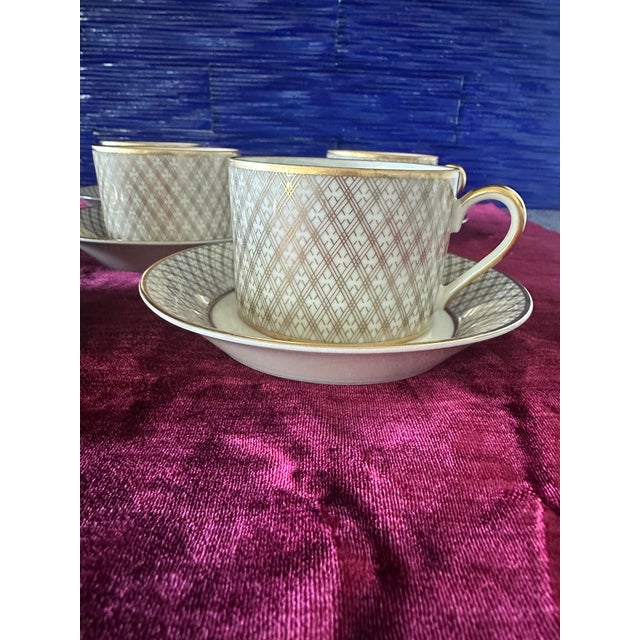 Fitz and Floyd Dynasty Pattern, 6 cups and saucers. These are fine porcelain in a beautiful creamy color with a 24ct gold...