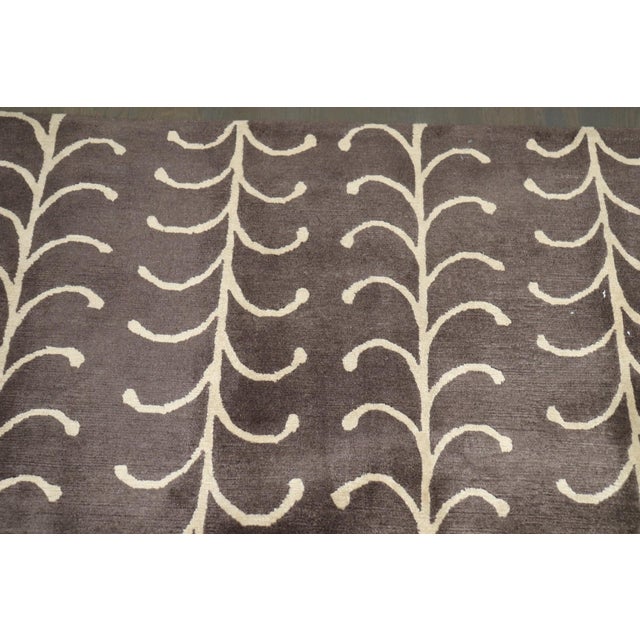 A one-of-a-kind 21st-century Tibetan Oversize rug in brown and cream. The Design is a modern stylized vine or fern /...