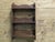 Arts and Crafts Decorative Open Front Wallhanging Shelf This little bookcase has 3 open shelves with a carved and...