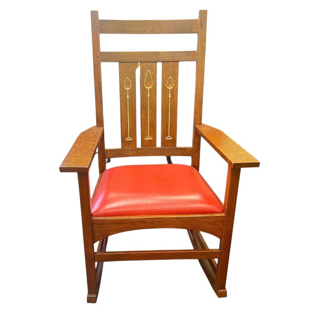 An absolutely pristine Stickley, Mission/Arts & Crafts style rocking chair. Solid cherry, wood frame, with milkweed-...